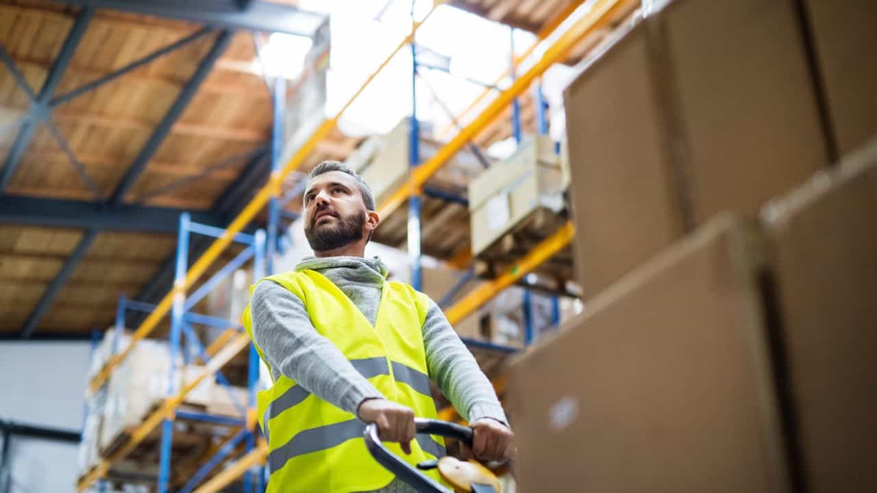 Man in safety vest in warehouse